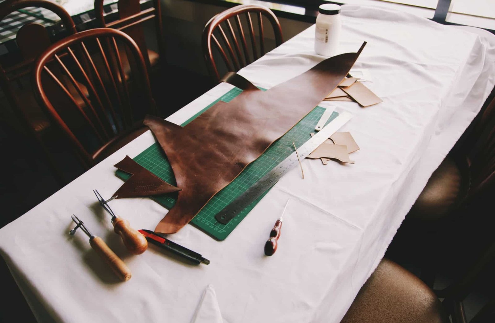 Pre-cut leather pieces ready for edge finishing and assembly