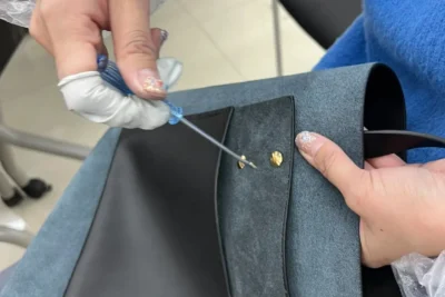 Leather tote bag making activity guided by Verdant studio members during a DIY craft event